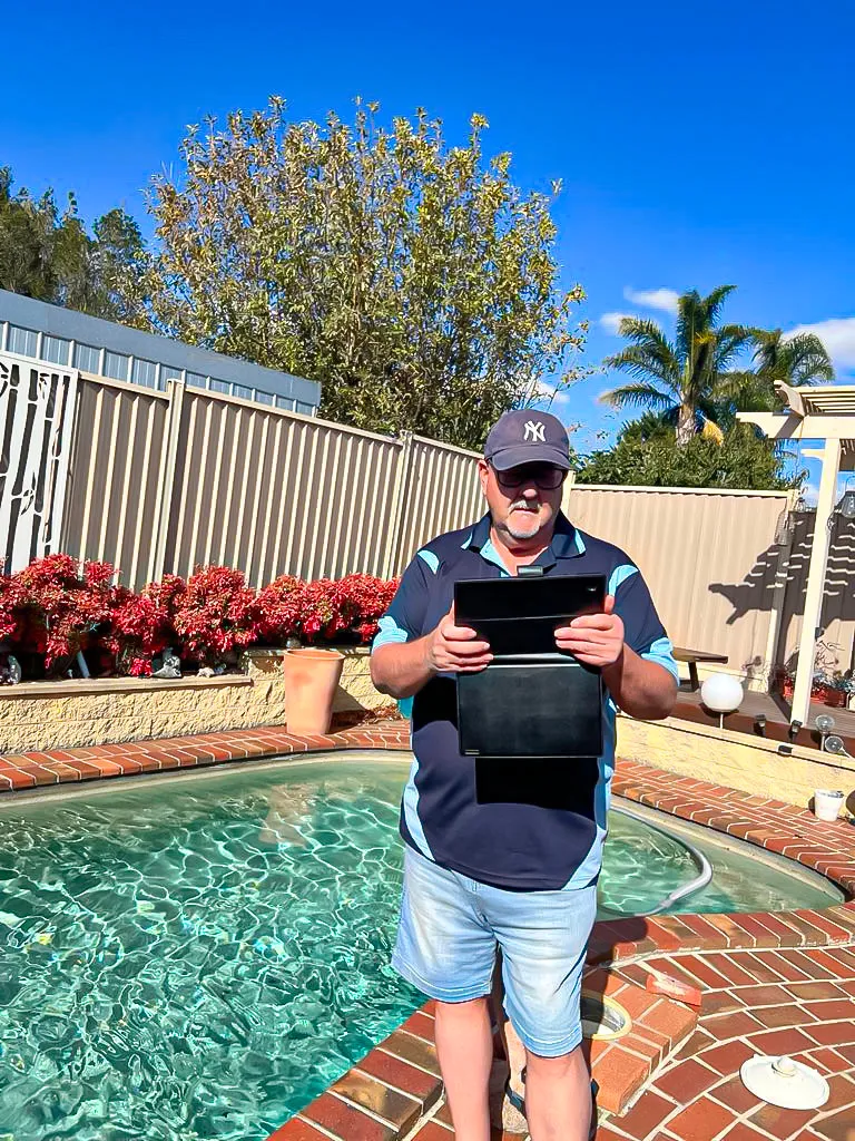 Pool barrier inspection underway in Hume with licensed inspector documenting results
